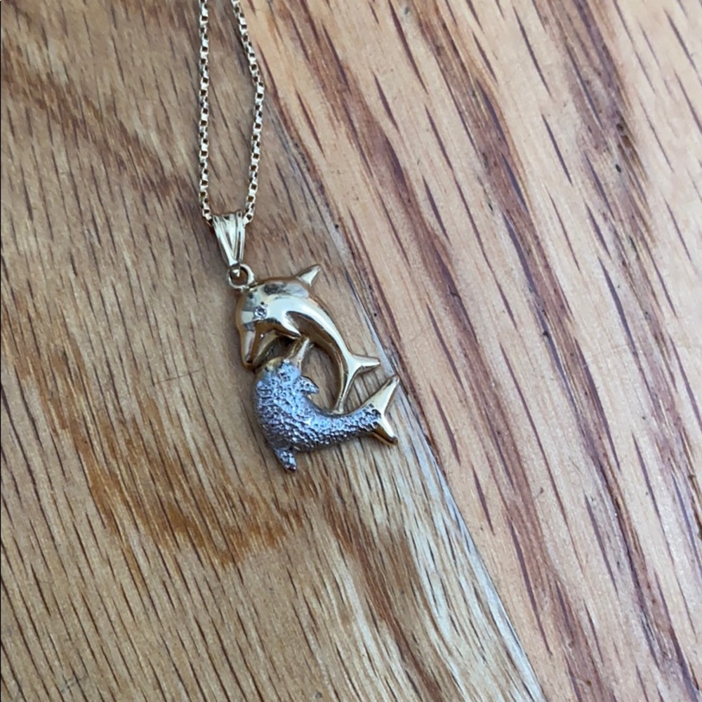 Gold chain with dolphins
